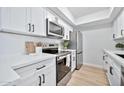Bright kitchen boasts white cabinets, stainless steel appliances, and ample counter space at 4141 N 31St St # 414, Phoenix, AZ 85016