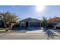 Newly built home with a two-car garage and well-manicured lawn at 6753 W Southgate Ave, Phoenix, AZ 85043