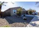 Landscaped front yard with gravel and drought-tolerant plants at 6753 W Southgate Ave, Phoenix, AZ 85043