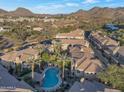 Aerial view showing complex with pool and mountain views at 7887 N 16Th St # 230, Phoenix, AZ 85020