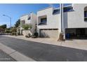 Side view of townhomes with garages and a paved pathway at 10 W Georgia Ave # 13, Phoenix, AZ 85013