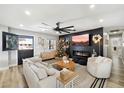 Spacious living room featuring a modern fireplace and stylish decor at 4015 E Catalina Dr, Phoenix, AZ 85018