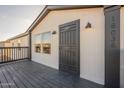 Dark gray front door with decorative metal detailing at 16036 N 70Th Dr, Peoria, AZ 85382