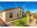Backyard with grassy lawn and arbor at 21836 W Hopi St, Buckeye, AZ 85326