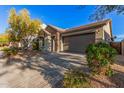 Single-story home with stone accents and a two-car garage at 28965 N 120Th Dr, Peoria, AZ 85383
