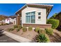 Landscaped front yard with drought-tolerant plants at 5273 N 207Th Dr, Buckeye, AZ 85396