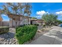 House exterior showcasing a well-maintained yard and driveway at 4503 E Robin Ln, Phoenix, AZ 85050