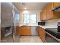 Bright kitchen featuring stainless steel appliances and light wood cabinets at 6709 W Luke Ave, Glendale, AZ 85303