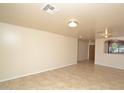 Spacious living room with light-colored tile flooring at 6709 W Luke Ave, Glendale, AZ 85303