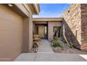 Inviting entryway with stone and wood accents at 10821 E Tusayan Trl, Scottsdale, AZ 85255