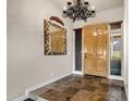 Spacious entryway with tiled floor and decorative mirror at 10821 E Tusayan Trl, Scottsdale, AZ 85255