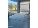 Covered porch with metal railing and a comfortable seating area at 16915 W Coronado Rd # 55B, Goodyear, AZ 85395