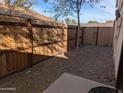 Small backyard with gravel and a wooden fence at 306 E Ludlow Dr # A, Avondale, AZ 85323