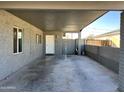 Covered carport with additional gated storage area at 3441 E Taylor St, Phoenix, AZ 85008