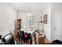 Small dining area with window and wood floors at 38234 W La Paz St, Maricopa, AZ 85138