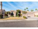 Beautiful single-story home with a three-car garage and lush landscaping at 550 N Mammoth Way, Chandler, AZ 85225