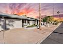 Condo exterior showcasing the driveway and street view at 7950 E Keats Ave # 150, Mesa, AZ 85209