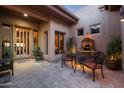 Charming courtyard with seating area near the home's entrance at 10843 E La Junta Rd, Scottsdale, AZ 85255