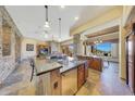 Gourmet kitchen featuring granite countertops and custom cabinetry at 10843 E La Junta Rd, Scottsdale, AZ 85255
