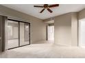 Bedroom with sliding door to patio and ceiling fan at 15050 N Thompson Peak Pkwy # 2006, Scottsdale, AZ 85260
