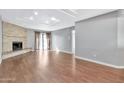 Living area with hardwood floors, fireplace and access to patio at 16616 E Palisades Blvd # 102, Fountain Hills, AZ 85268