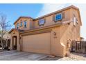 Two-story house with gravel driveway and attached garage at 17395 W Straight Arrow Ln, Surprise, AZ 85387