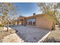 Home's backyard features a sparkling pool and patio area at 18088 W Narramore Rd, Goodyear, AZ 85338