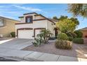 Two-story house with two-car garage and desert landscaping at 2123 E La Costa Dr, Chandler, AZ 85249