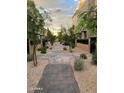Landscaped walkway connecting the townhomes in a community setting at 1406 W Main St # 140, Mesa, AZ 85201