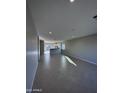 Open living room with tile floors and access to kitchen at 15494 S Kline Pl, Arizona City, AZ 85123