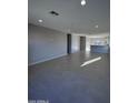 Open living room with tile floors and access to kitchen at 15494 S Kline Pl, Arizona City, AZ 85123