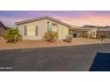 Tan single story home with carport and desert landscaping at 3301 S Goldfield Rd # 2015, Apache Junction, AZ 85119