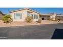 Tan single story home with carport and desert landscaping at 3301 S Goldfield Rd # 2015, Apache Junction, AZ 85119