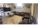 Spacious living room with hardwood floors and comfy furniture at 3818 W Rose Ln, Phoenix, AZ 85019