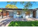 Home exterior featuring a covered patio and a landscaped front yard at 1010 W Oregon Ave, Phoenix, AZ 85013