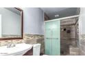 Updated bathroom with a walk-in shower and tiled walls at 20165 W Moccasin Trl, Buckeye, AZ 85326
