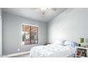 Bright bedroom with a large window and plush bedding at 20165 W Moccasin Trl, Buckeye, AZ 85326