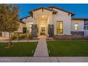 Beautiful home exterior with lush landscaping and welcoming entryway at 20698 E Marsh Rd, Queen Creek, AZ 85142