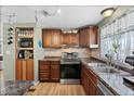 Modern kitchen featuring stainless steel appliances and wood cabinets at 2261 N Demaret Dr, Mesa, AZ 85215