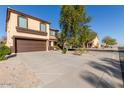 Two-story house with driveway and street view at 23582 W Wier Ave, Buckeye, AZ 85326