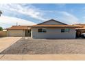 Newly renovated single-story home with a large driveway and gravel landscaping at 5534 N 42Nd Ln, Phoenix, AZ 85019