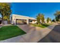 Beautiful contemporary home with well manicured lawn at 8508 E Mustang Trl, Scottsdale, AZ 85258
