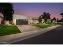 Modern home with a large driveway and beautiful landscaping at 8508 E Mustang Trl, Scottsdale, AZ 85258