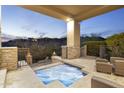 Relaxing hot tub with hilltop views at dusk at 9732 N Fireridge Trl, Fountain Hills, AZ 85268