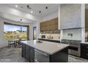 Modern kitchen with island, high-end appliances, and expansive views at 9732 N Fireridge Trl, Fountain Hills, AZ 85268