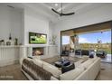 Spacious living room with fireplace and sliding doors to patio at 9732 N Fireridge Trl, Fountain Hills, AZ 85268