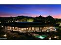 Backyard view of home with pool at night at 9782 E Troon North Dr, Scottsdale, AZ 85262