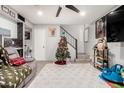 Living room with Christmas tree, TV, and workspace at 4041 W Wonderview Rd, Phoenix, AZ 85019