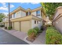 Two-story townhome with attached garage and walkway at 4343 N 21St St # 203, Phoenix, AZ 85016