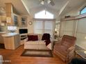 Bright living room with comfy seating and large windows at 1081 S Shoshone Dr, Apache Junction, AZ 85119